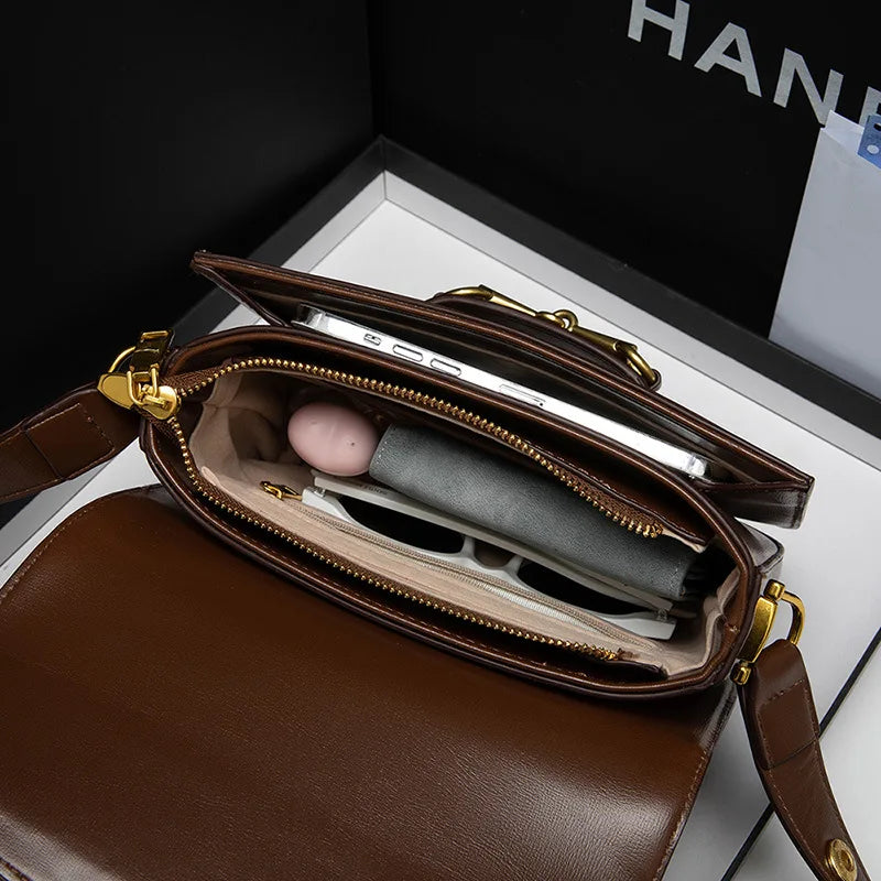 Ladies genuine leather saddle bag, single shoulder bag underarm bag, new fashion versatile niche trend crossbody bag.